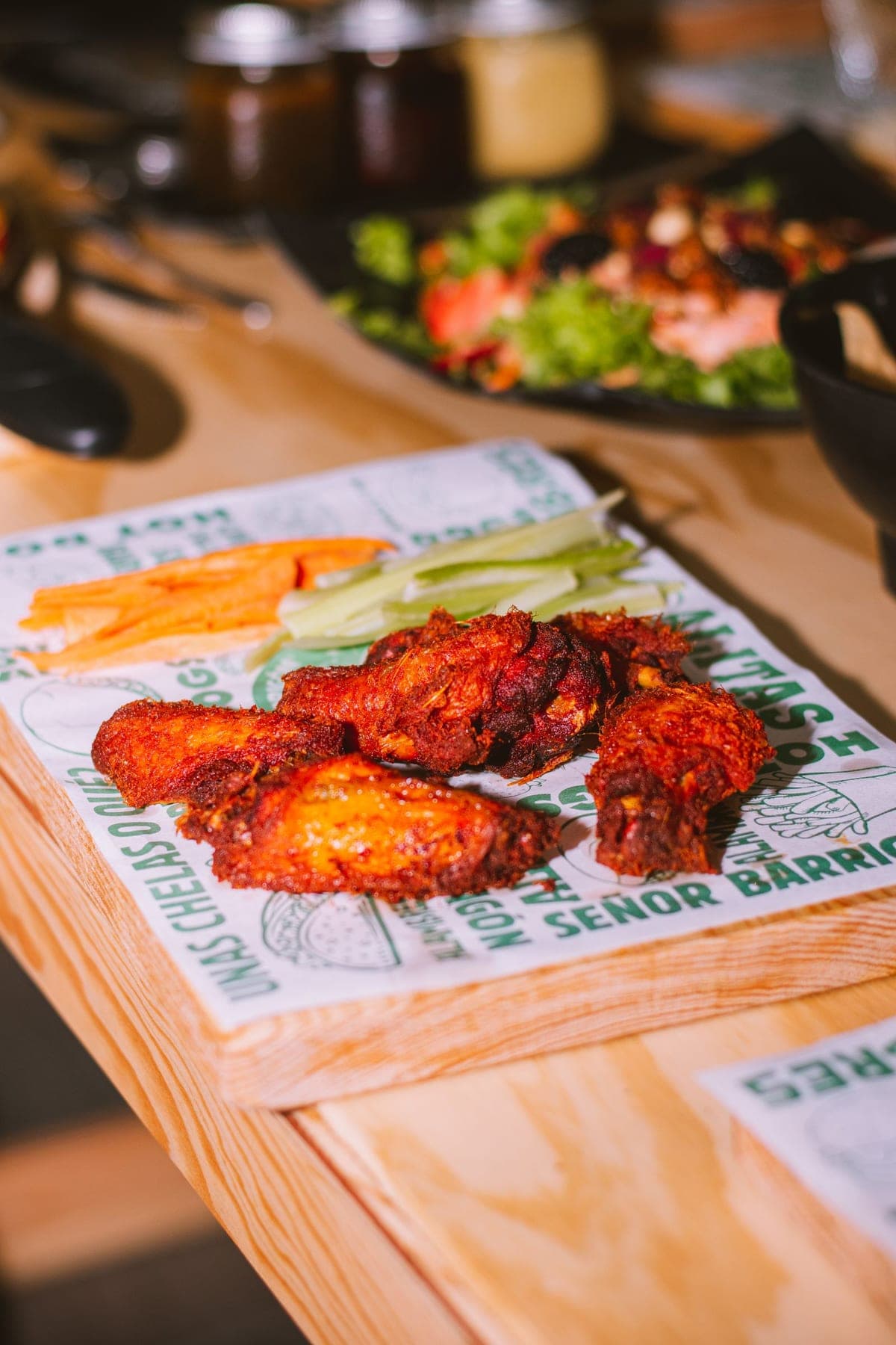 Sauced jumbo chicken wings with celery and carrots